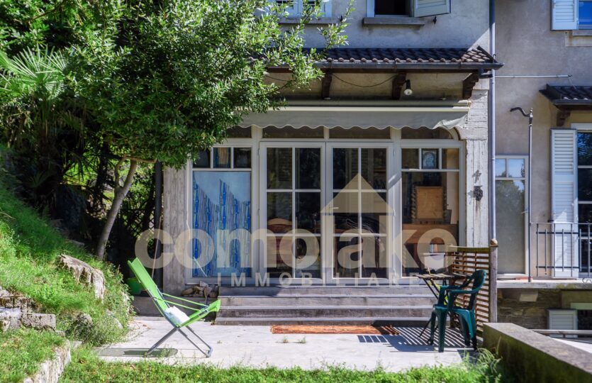 House with garden and lake view