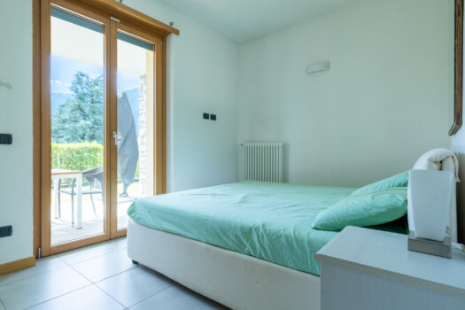 Three-room apartment with garden in Tremezzina – residence with swimming pool