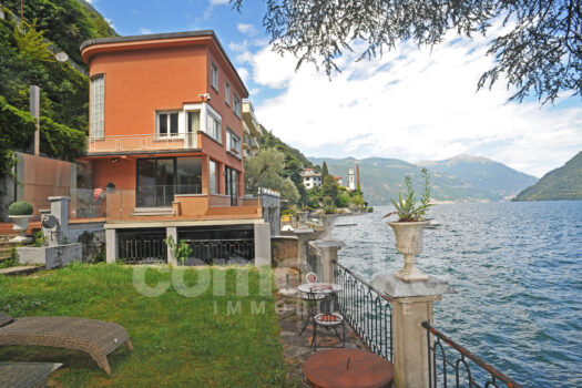Modern lakefront villa with a large garden