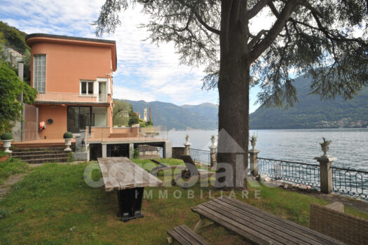 Modern lakefront villa with a large garden
