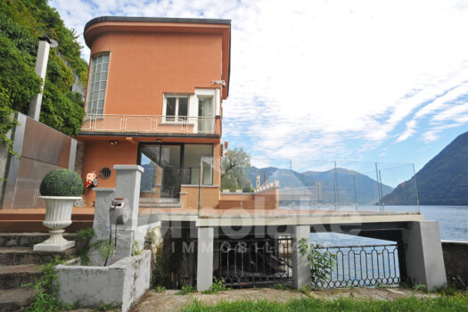 Modern lakefront villa with a large garden