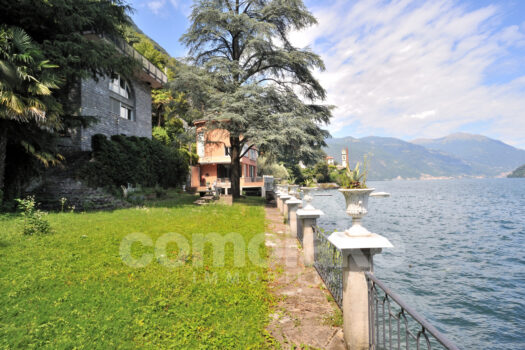 Modern lakefront villa with a large garden