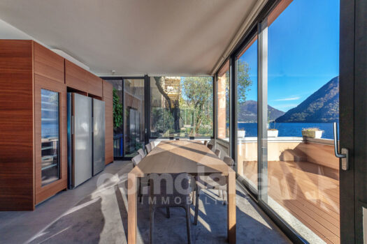 Modern lakefront villa with a large garden