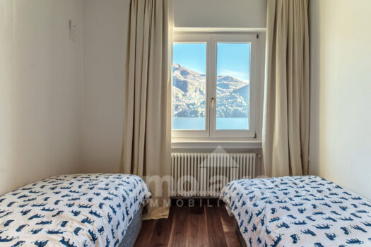 Modern lakefront villa with a large garden