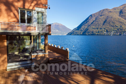 Modern lakefront villa with a large garden