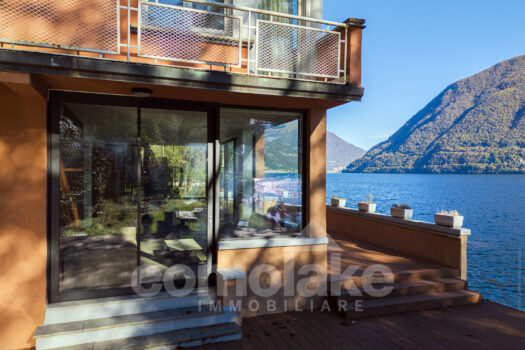 Modern lakefront villa with a large garden