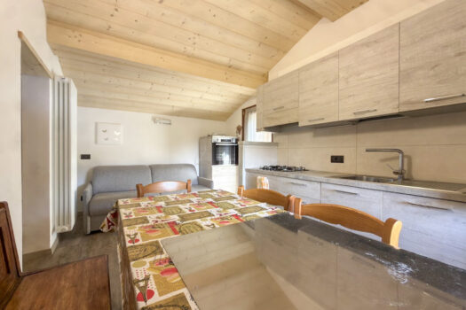 Stone house with a garden on a hillside in Menaggio