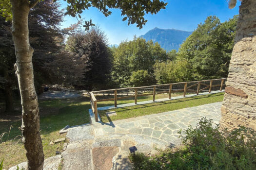 Stone house with a garden on a hillside in Menaggio