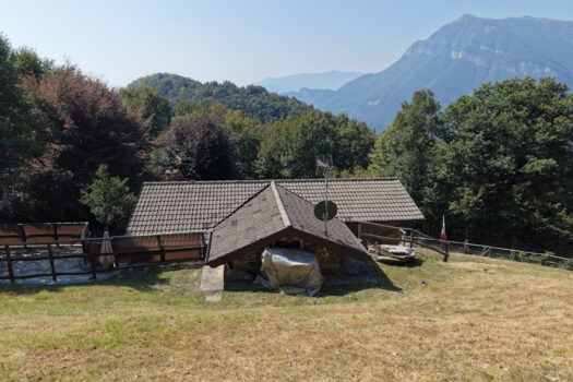 Stone house with a garden on a hillside in Menaggio