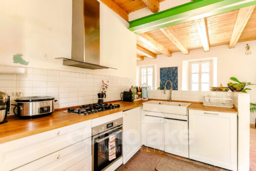 Casa di lago con giardino a Torno